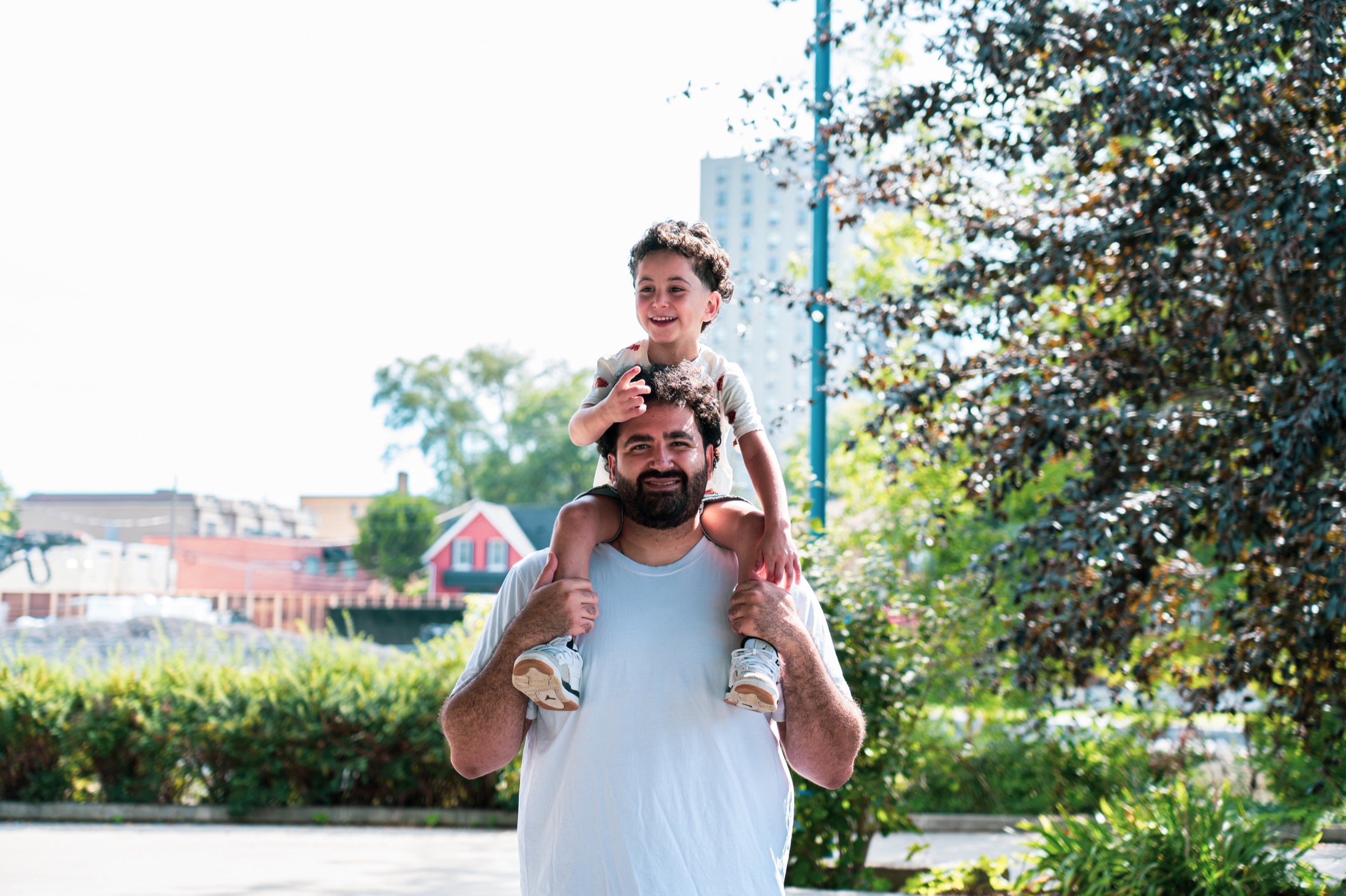 Jad El Ghali carrying a smiling child on his shoulders