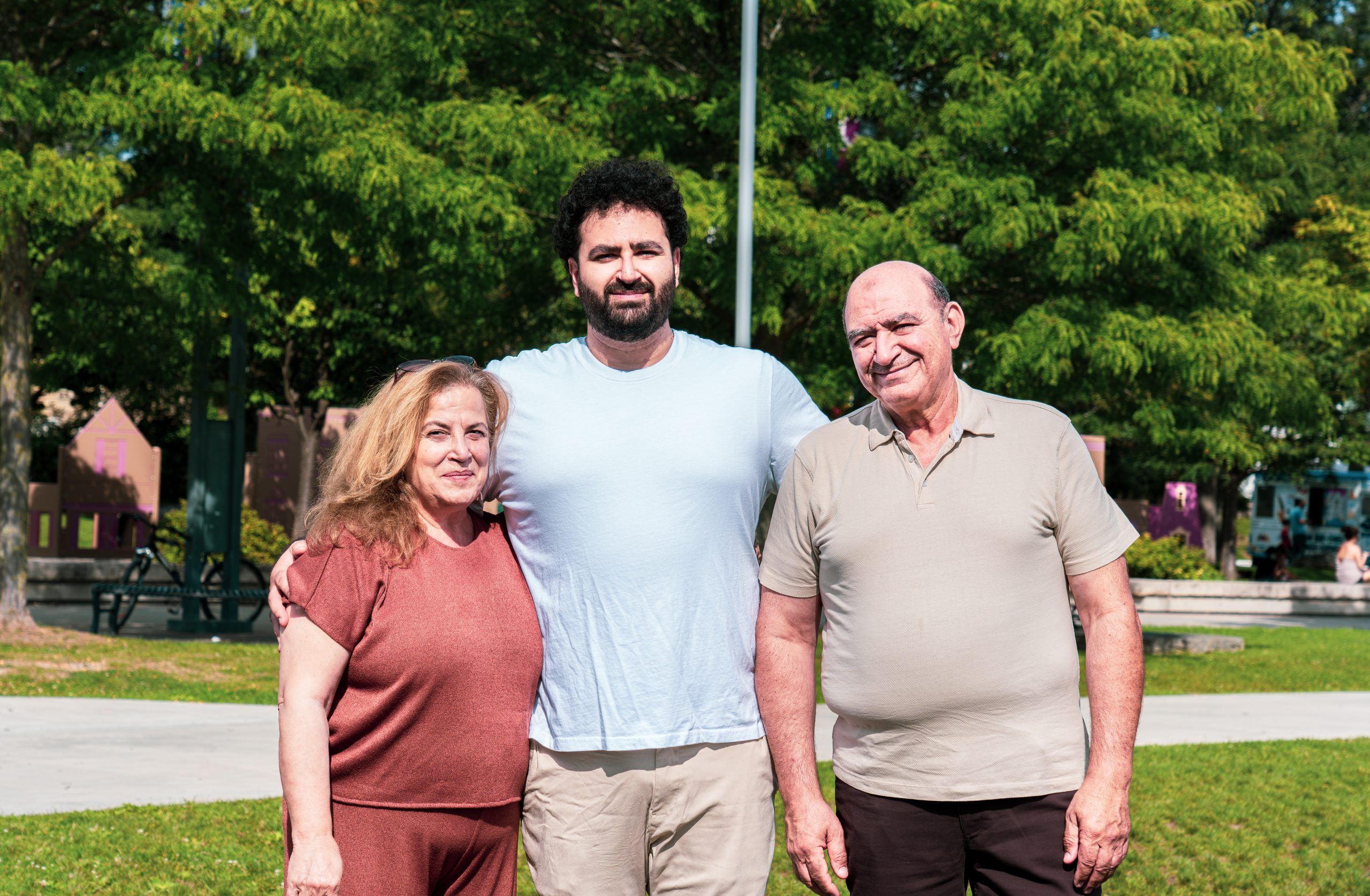 Jad El Ghali standing with two community members in a Mississauga park